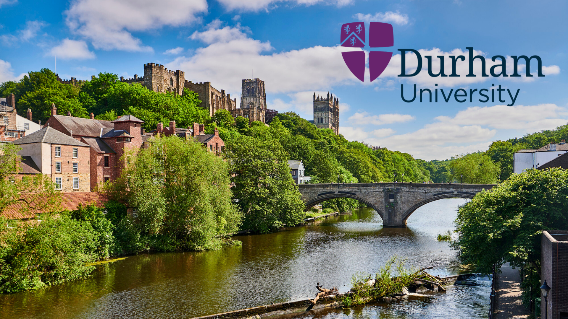 A lovely view of a bridge over a river with the Durham University campus in the background
